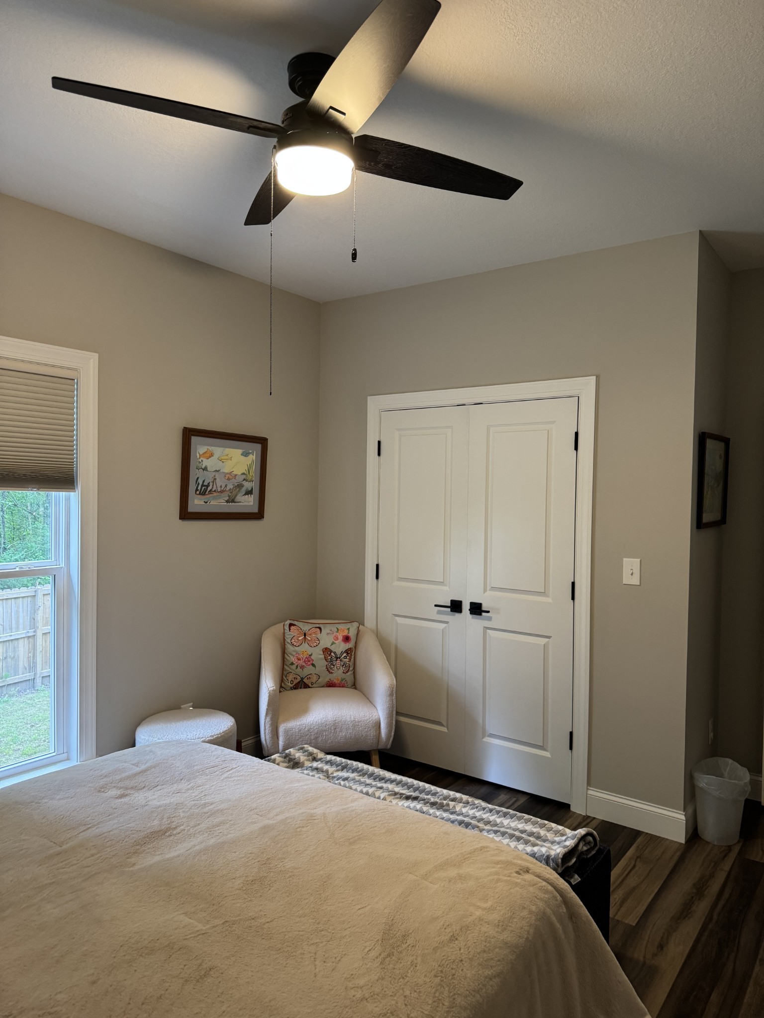 662 Ketner Mill Road Whitwell, TN 37397 - Photo 18 of 26 a bedroom with a large bed and a chandelier
