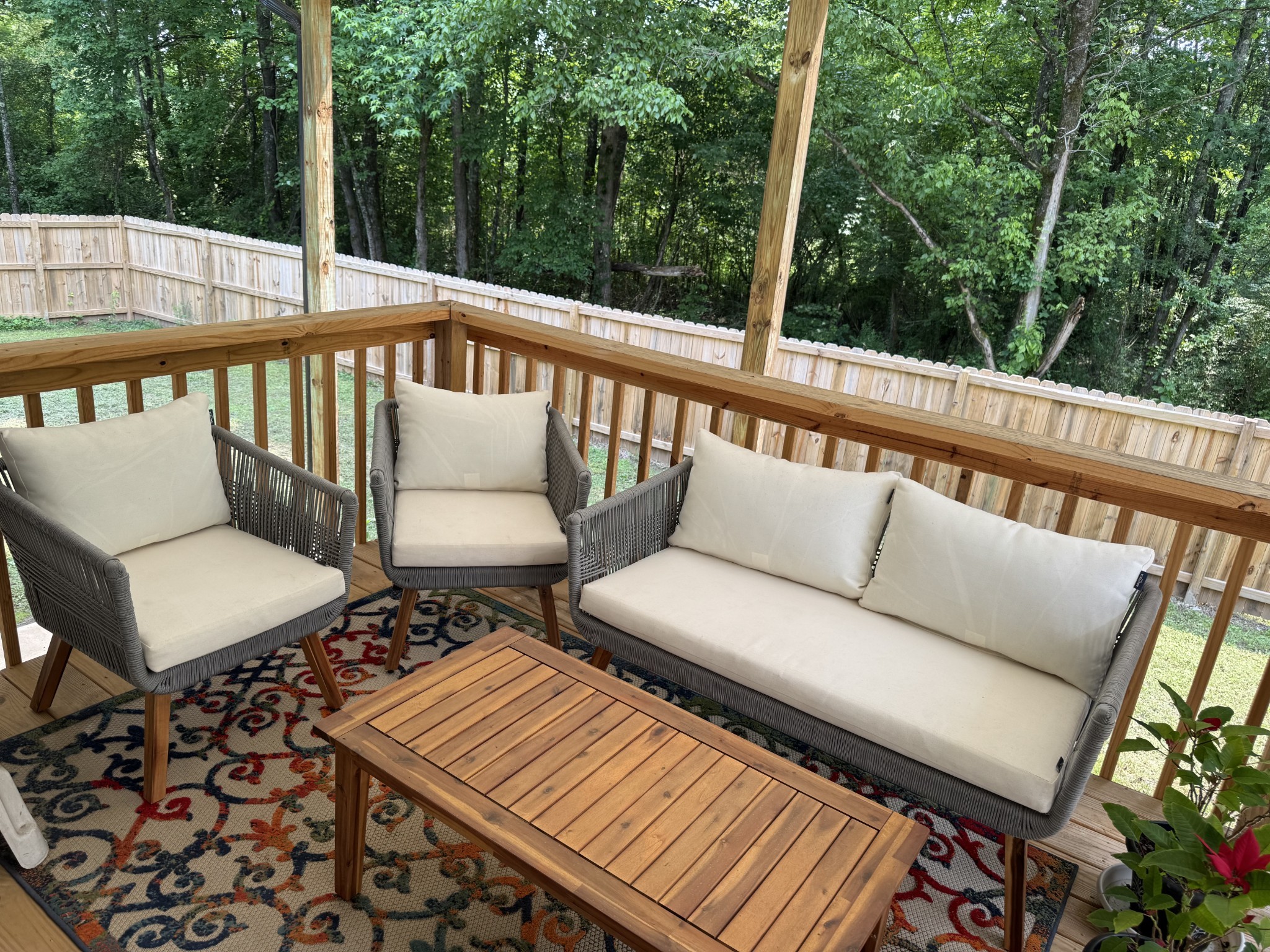 662 Ketner Mill Road Whitwell, TN 37397 - Photo 21 of 26 a balcony with wooden floor and outdoor seating