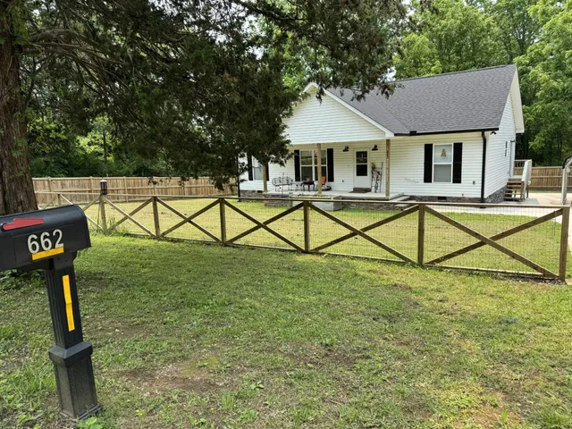 a house that has tree in front of it
