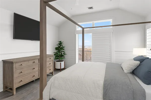 a bathroom with a toilet a sink a vanity and mirror