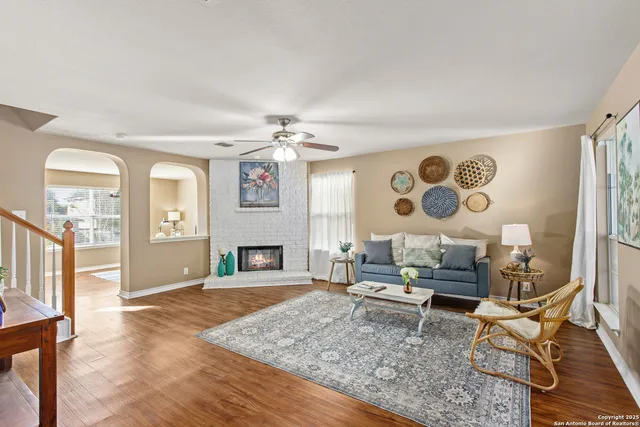 a living room with furniture and a fireplace