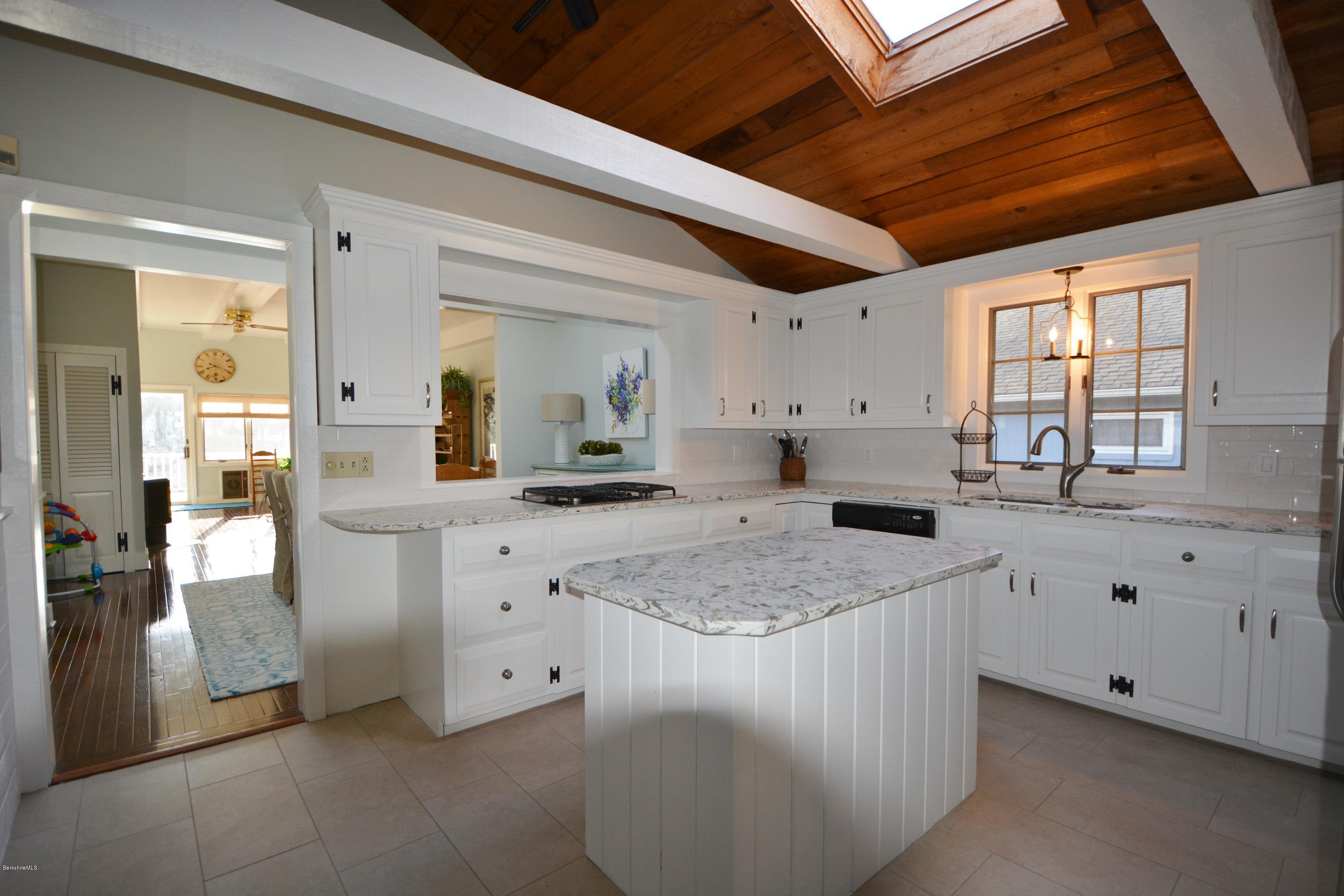 77 North Gate Island Road Otis, MA 01029 - Photo 11 of 25 a kitchen with white cabinets and sink