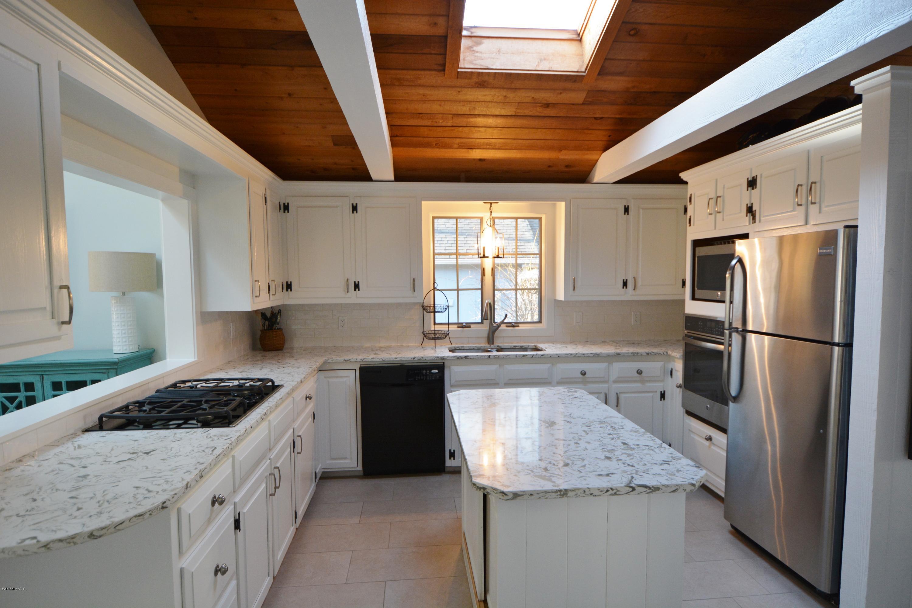 77 North Gate Island Road Otis, MA 01029 - Photo 12 of 25 a kitchen with a refrigerator and a sink