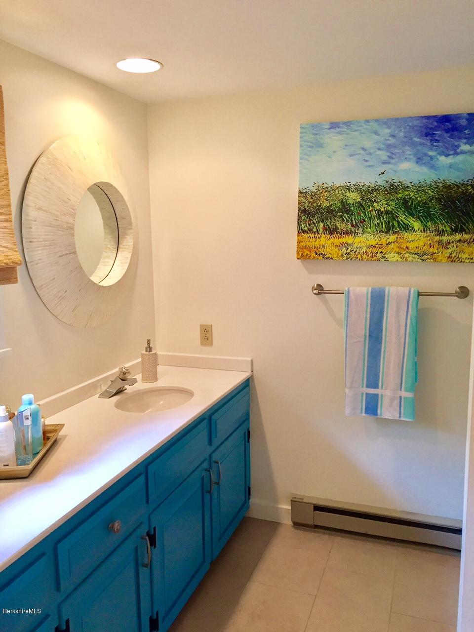77 North Gate Island Road Otis, MA 01029 - Photo 13 of 25 a bathroom with a sink and a mirror