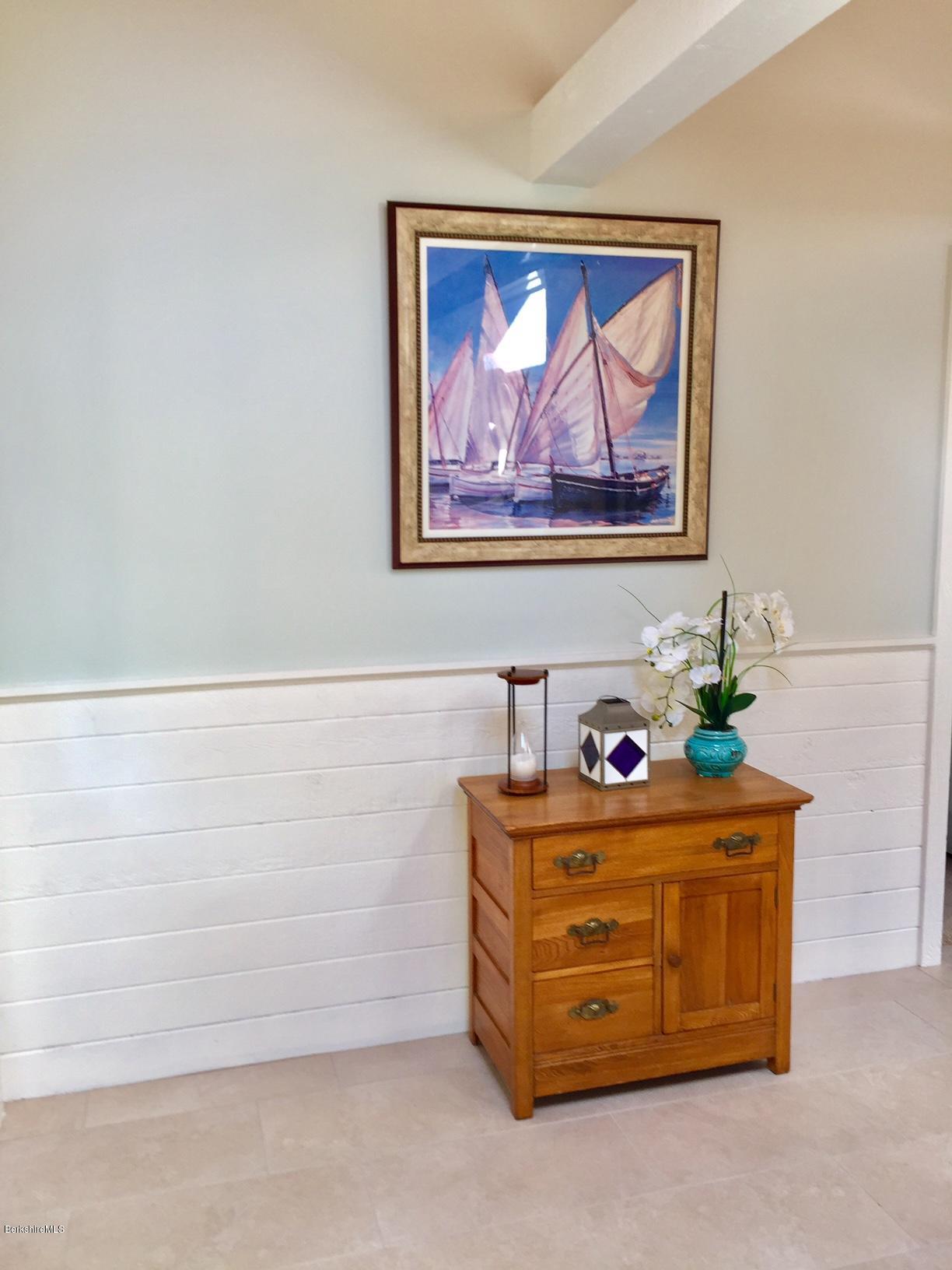 77 North Gate Island Road Otis, MA 01029 - Photo 16 of 25 a room with a cabinet and a painting on the wall