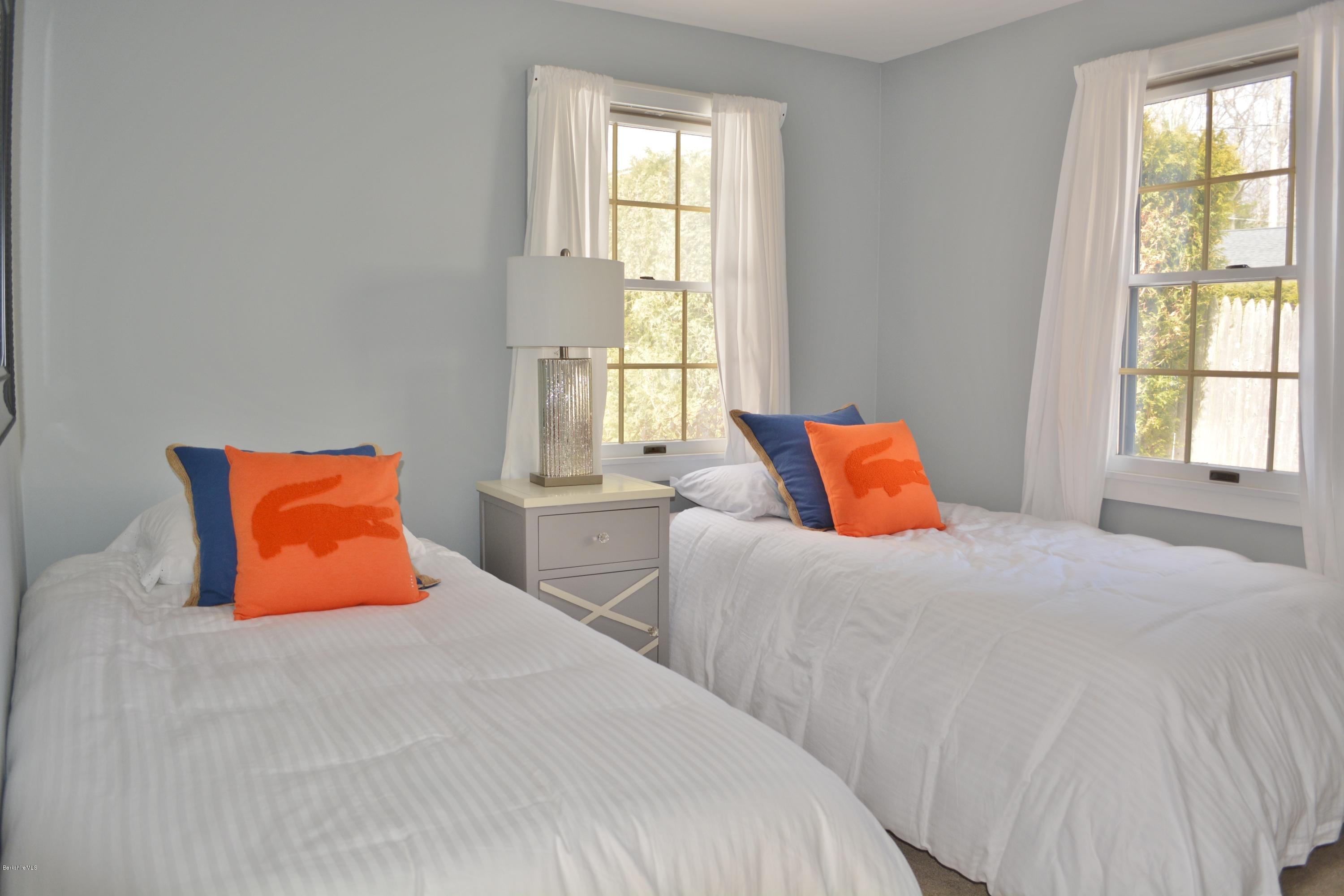 77 North Gate Island Road Otis, MA 01029 - Photo 19 of 25 a bedroom with two beds and a window