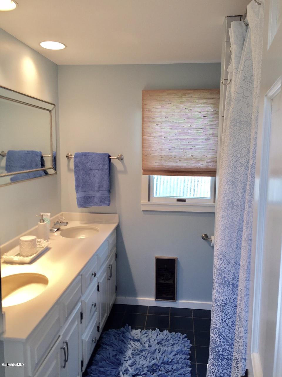77 North Gate Island Road Otis, MA 01029 - Photo 20 of 25 a bathroom with a sink and a mirror