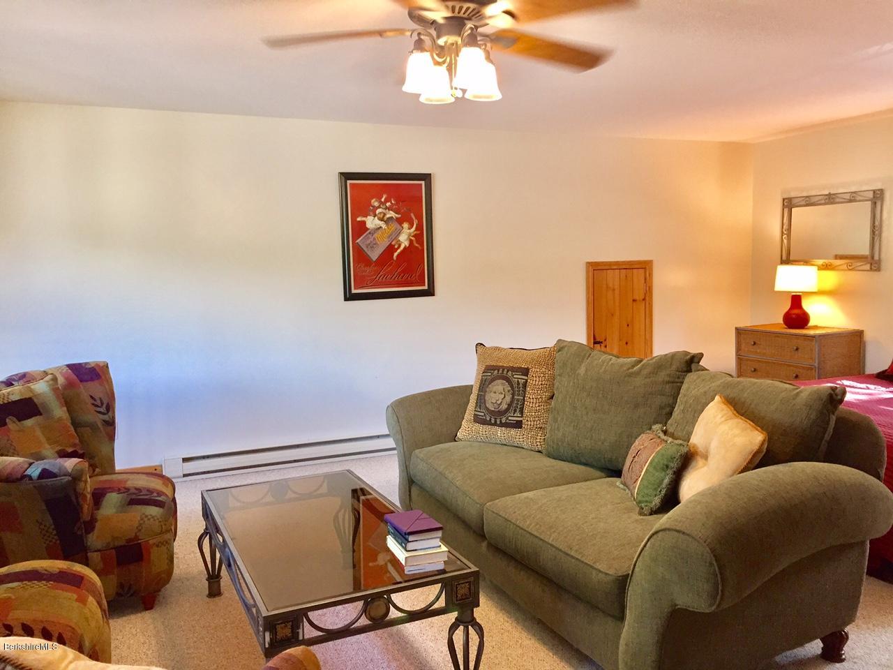 77 North Gate Island Road Otis, MA 01029 - Photo 24 of 25 a living room with furniture and a couch