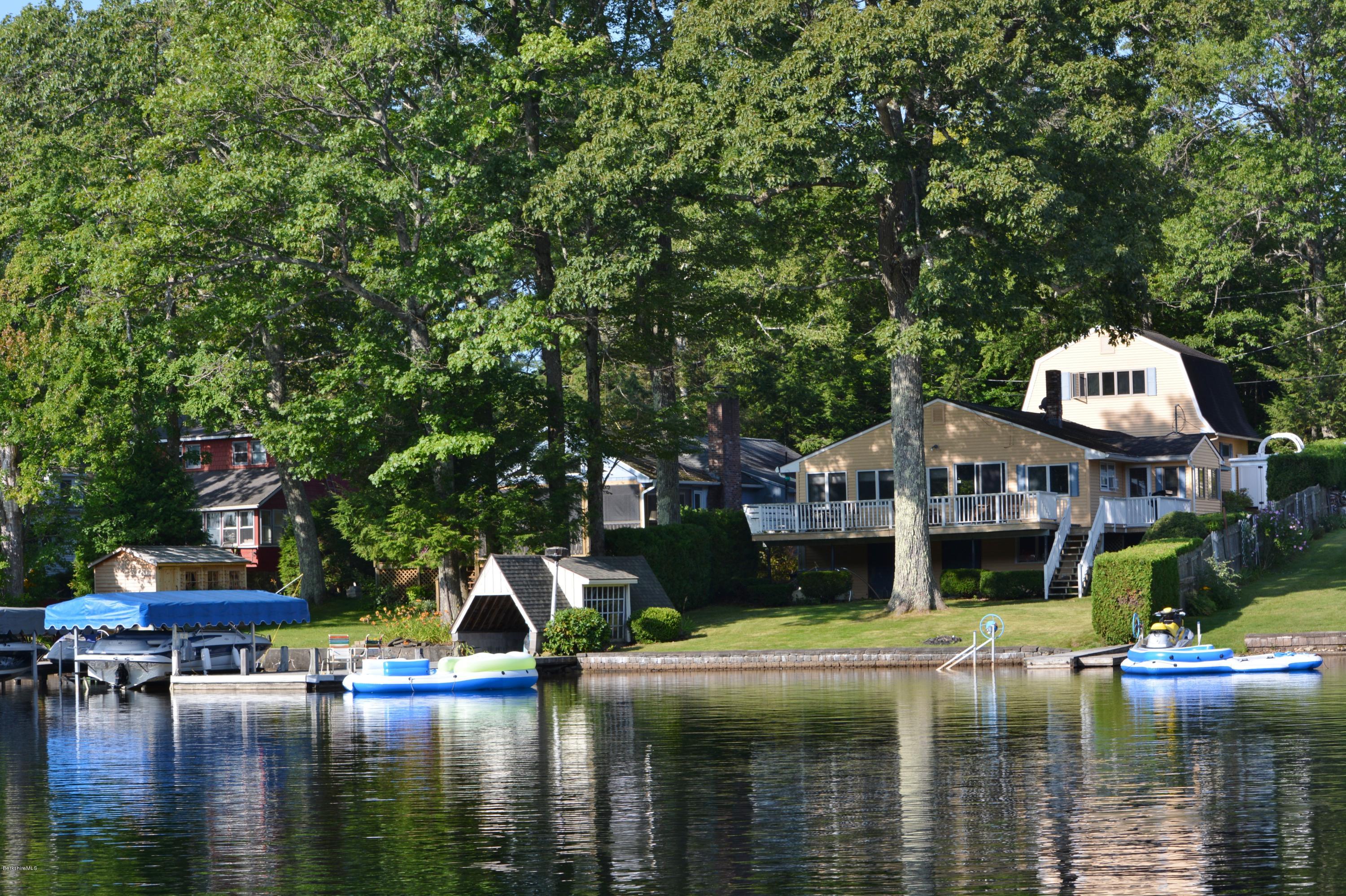 77 North Gate Island Road Otis, MA 01029 - Photo 6 of 25 a house with swimming pool in front of it
