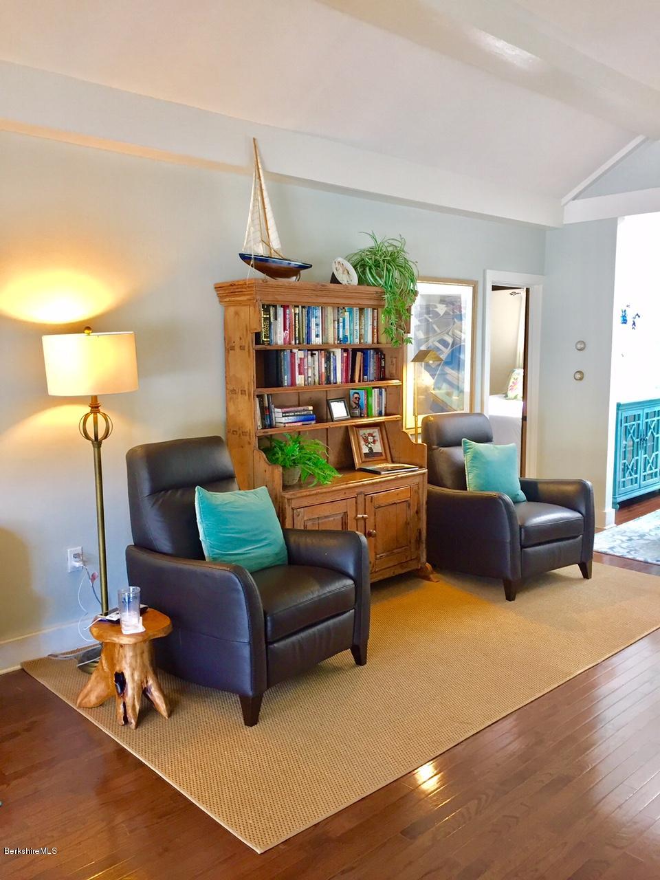 77 North Gate Island Road Otis, MA 01029 - Photo 8 of 25 a living room with furniture and a lamp