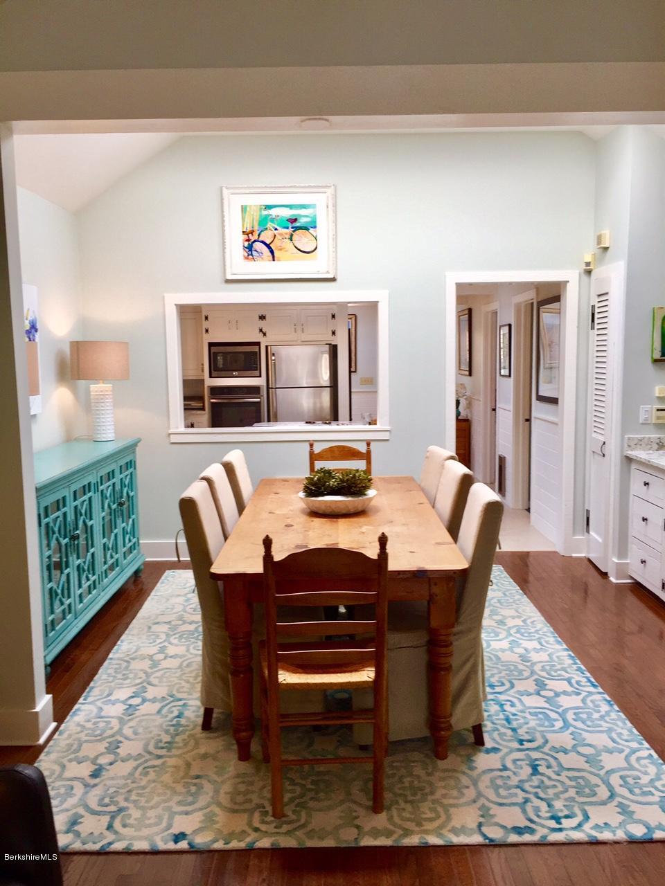 77 North Gate Island Road Otis, MA 01029 - Photo 9 of 25 a view of a dining room with furniture window and wooden floor