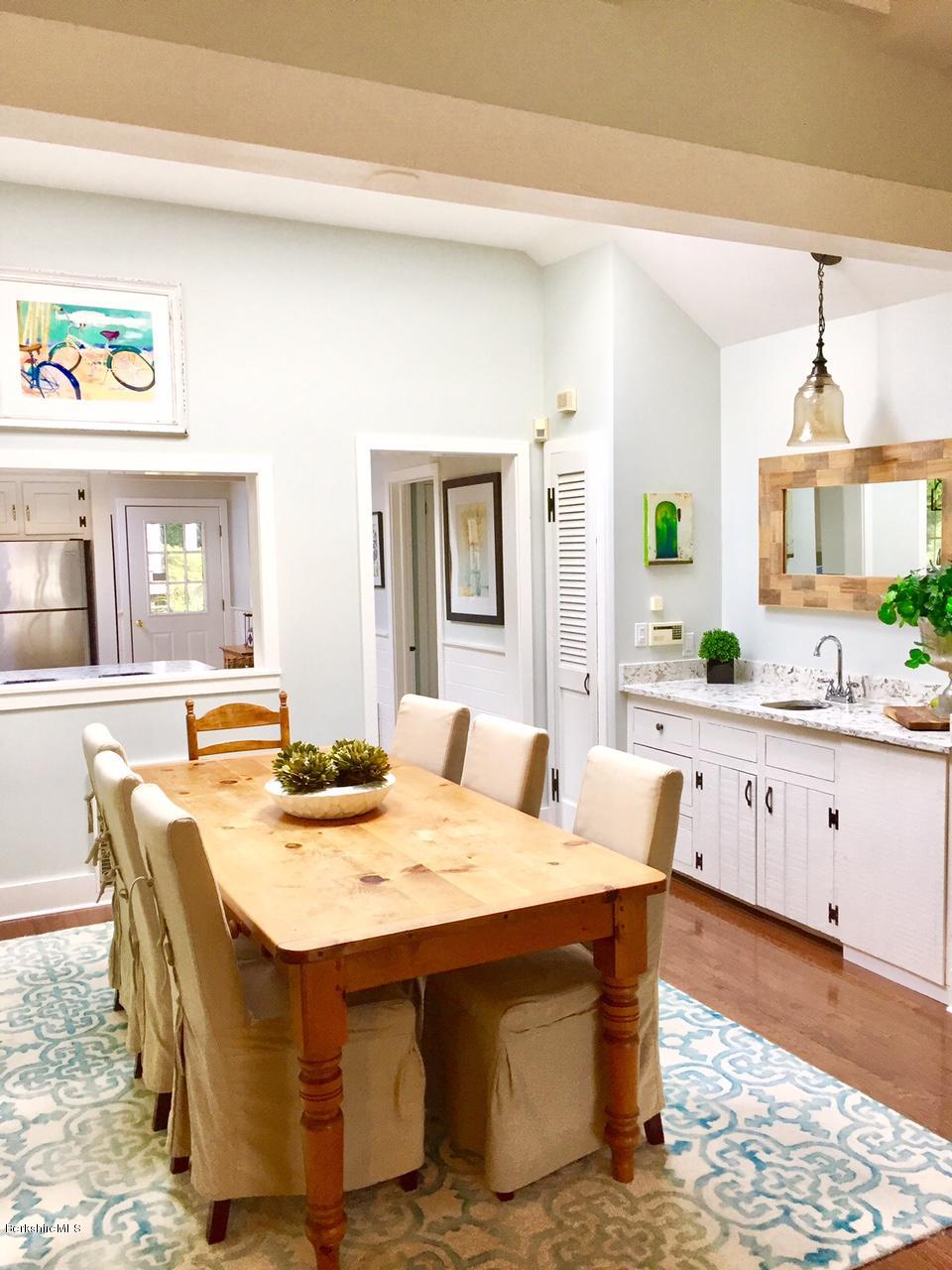 77 North Gate Island Road Otis, MA 01029 - Photo 10 of 25 a view of kitchen with dining table and chairs