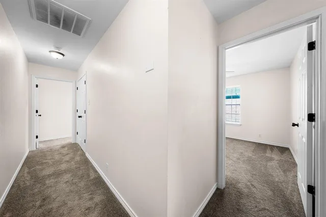 a view of hallway with closet