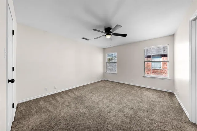 a view of a big room with carpet