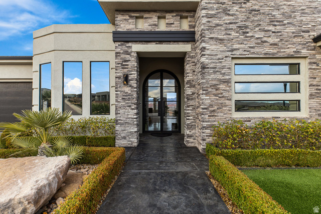 3022 West Sesia Way St. George, UT 84770 - Photo 11 of 52 Entrance to property featuring stone siding, french doors, and stucco siding