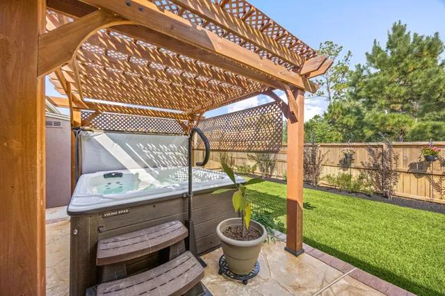 a view of a porch with furniture and garden