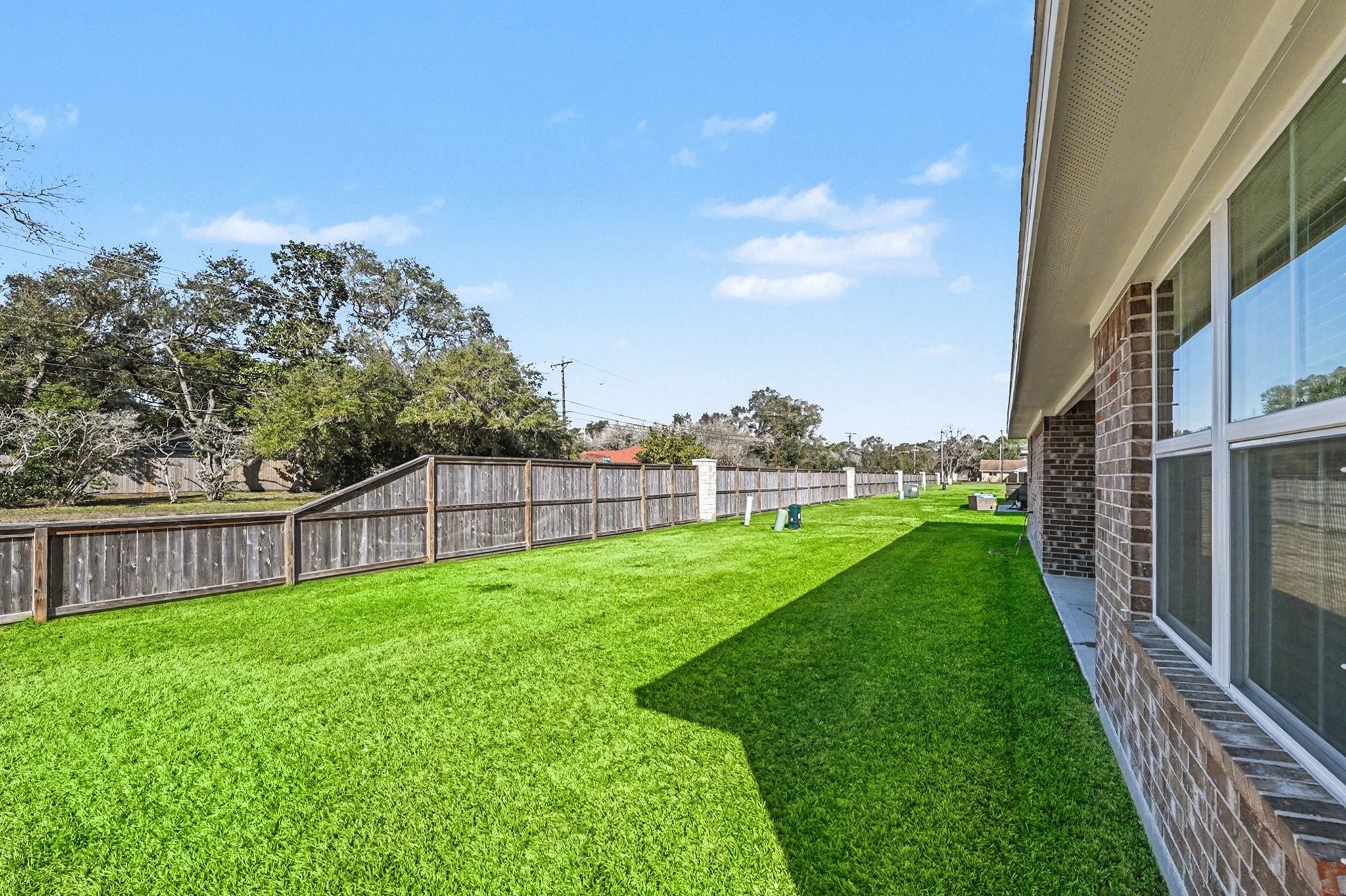 601 Greystone Lane Angleton, TX 77515 - Photo 31 of 32 a view of a garden with a large trees