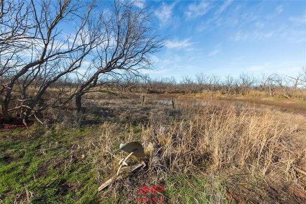 a view of lake with green space