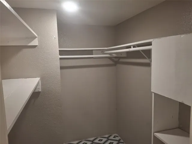 a view of a room with racks on the wall