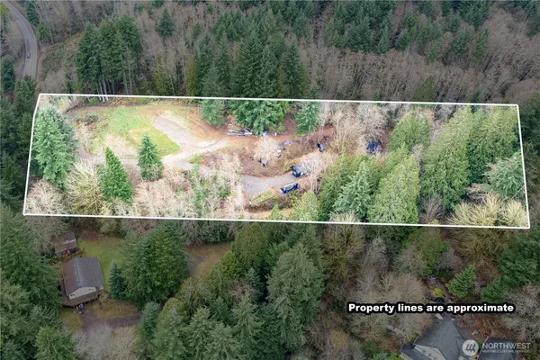 an aerial view of a house and a yard