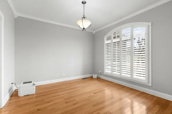 a bedroom with a bed couch and window