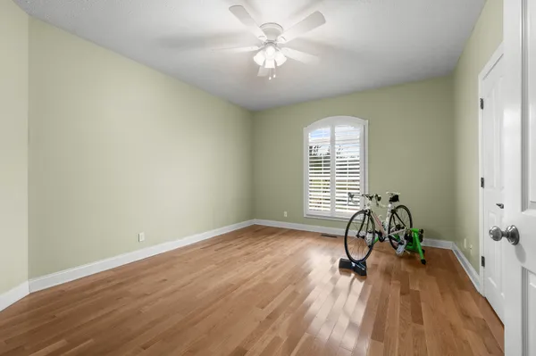 a living room with furniture chandelier and a window