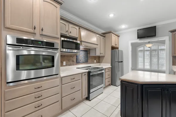 a kitchen with a sink and a window