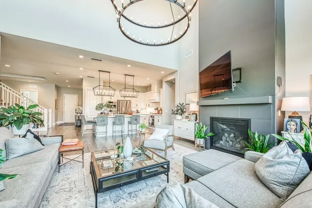 a large white bathroom with a bathtub sink and mirror