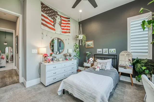 a kitchen with a sink a stove cabinets and a window