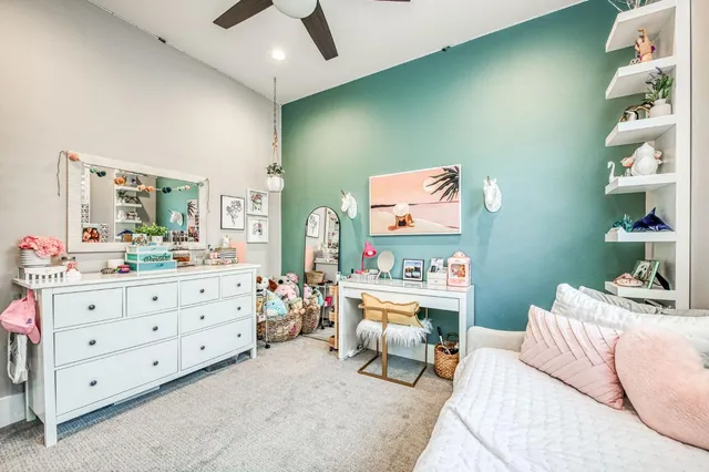 a living room with furniture kitchen view and a potted plant