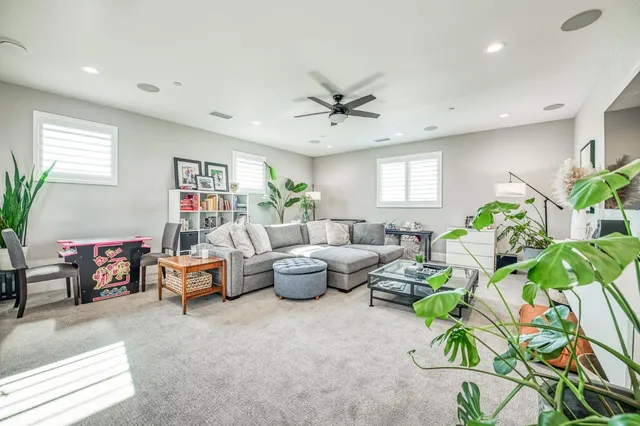 a view of a chairs and table in backyard of the house
