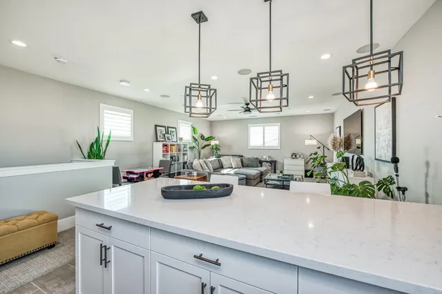 a view of an outdoor dining space with a table and chairs
