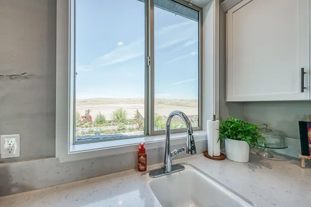 a view of yard with swimming pool and green space