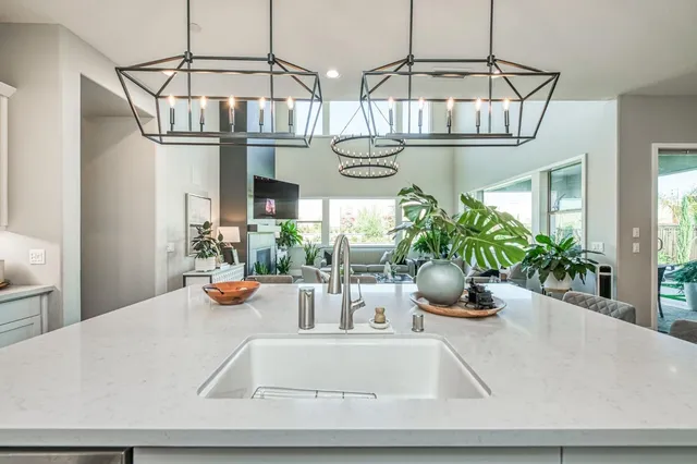 a kitchen with stainless steel appliances a stove and cabinets