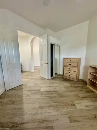 a view of a livingroom with a ceiling fan and window