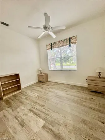a living room with a couch and a chandelier