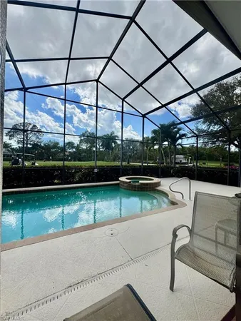 a view of a swimming pool with a patio