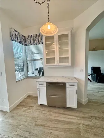 a view of living room with granite countertop furniture and fireplace