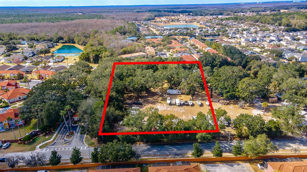 an outdoor space with lots of trees in the background