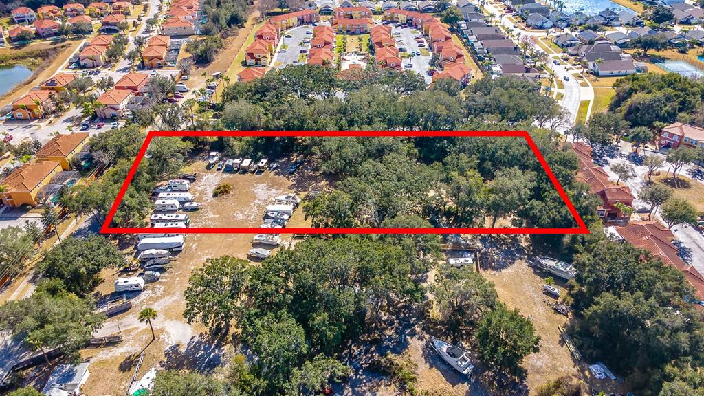 940 North Roma Way Kissimmee, FL 34746 - Photo 11 of 15 a view of a potted flower in a yard