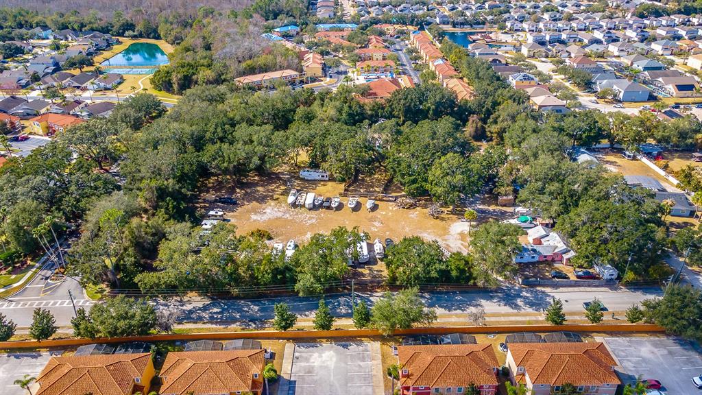 940 North Roma Way Kissimmee, FL 34746 - Photo 12 of 15 an aerial view of residential houses with outdoor space and swimming pool
