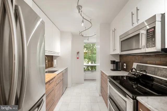 a living room with furniture flat screen tv and a fireplace