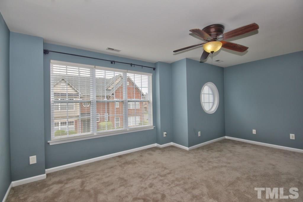 9904 Grettle Court Raleigh, NC 27617 - Photo 11 of 22 Spacious bedrooms in this home! Great windows and both bedrooms feature full baths. Carpeted throughout the upstairs.