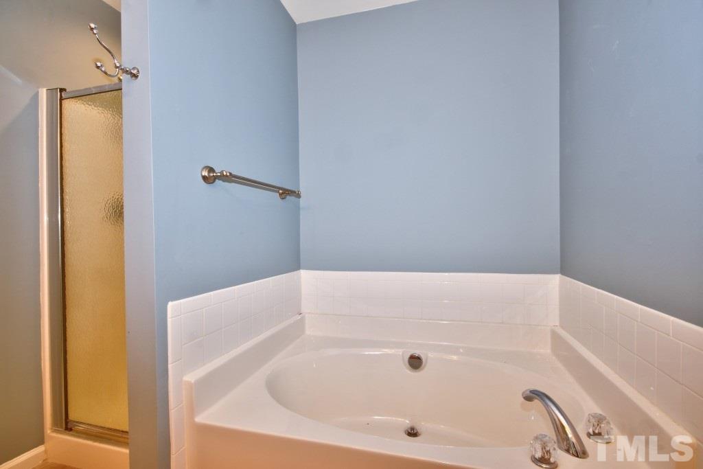 9904 Grettle Court Raleigh, NC 27617 - Photo 14 of 22 Enjoy a great book and a glass of wine while soaking in your tub after a hard day of work or play!