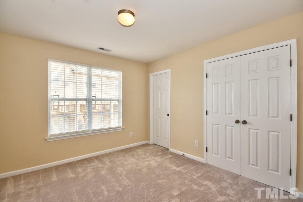 9904 Grettle Court Raleigh, NC 27617 - Photo 15 of 22 Large bedroom with great natural light and also has a full bath.
