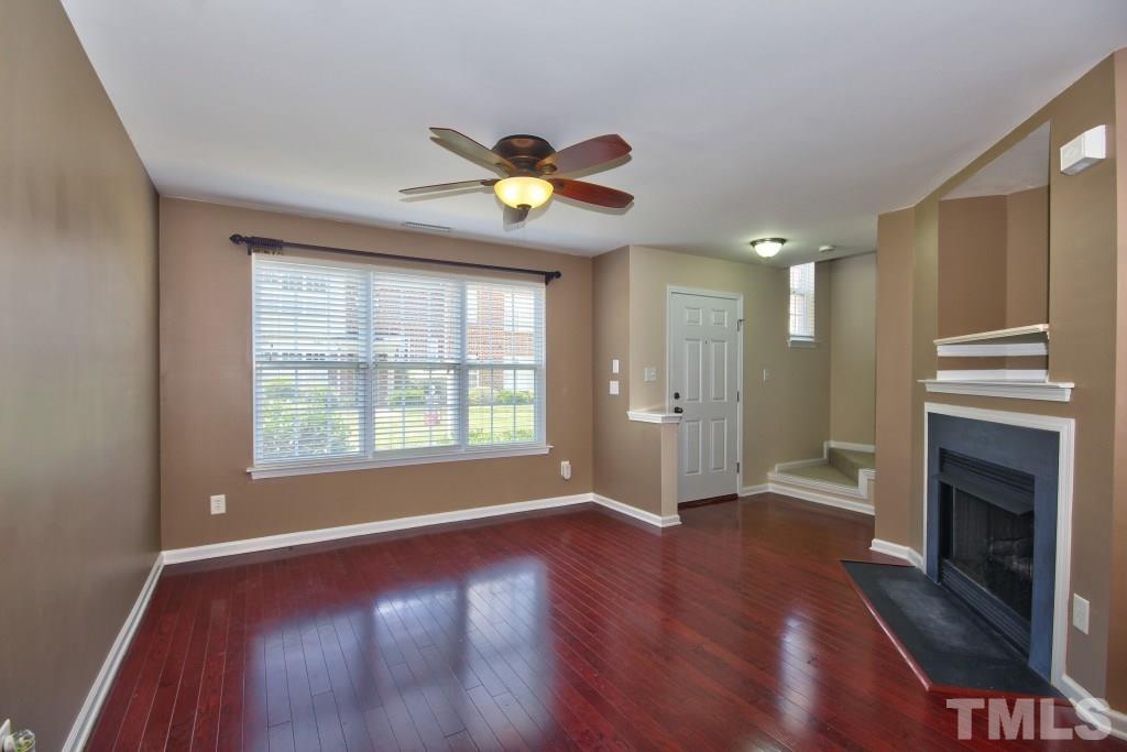 9904 Grettle Court Raleigh, NC 27617 - Photo 4 of 22 Gorgeous hard wood floors and a gas fireplace with built in's over the mantel. Great open space!