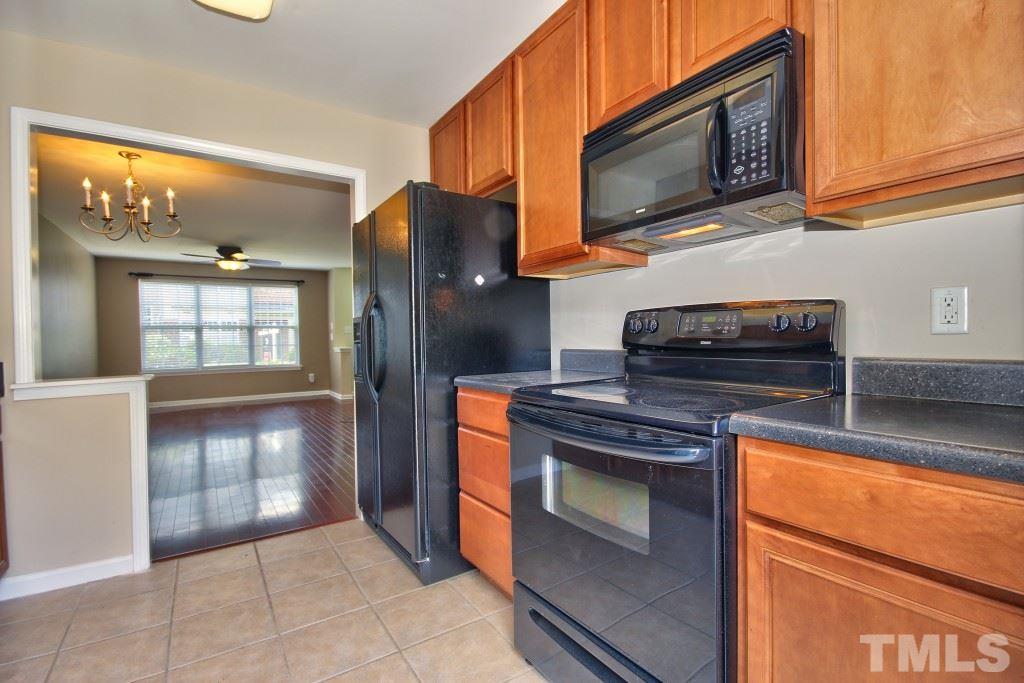 9904 Grettle Court Raleigh, NC 27617 - Photo 9 of 22 Opens right into the dining room so you'll never miss a moment of conversation while entertaining!