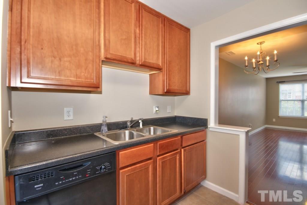 9904 Grettle Court Raleigh, NC 27617 - Photo 10 of 22 Kenmore refrigerator, electric stovetop, double sinks and a dishwasher included.