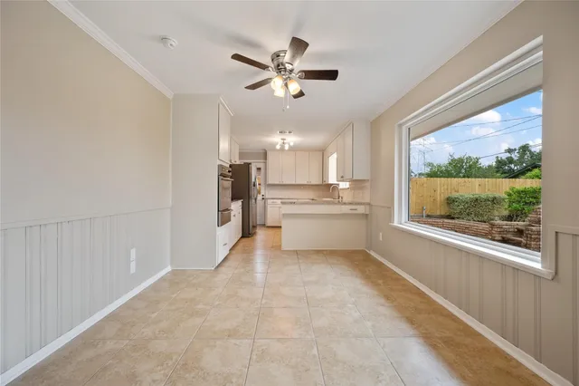 a view of a kitchen with a sink dishwasher and a refrigerator