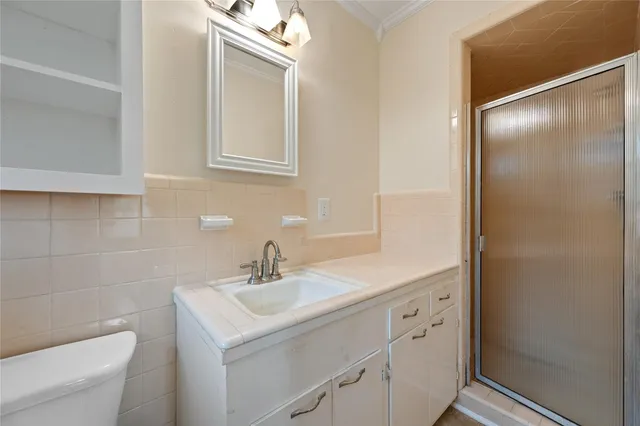 a bathroom with a sink toilet a mirror and vanity